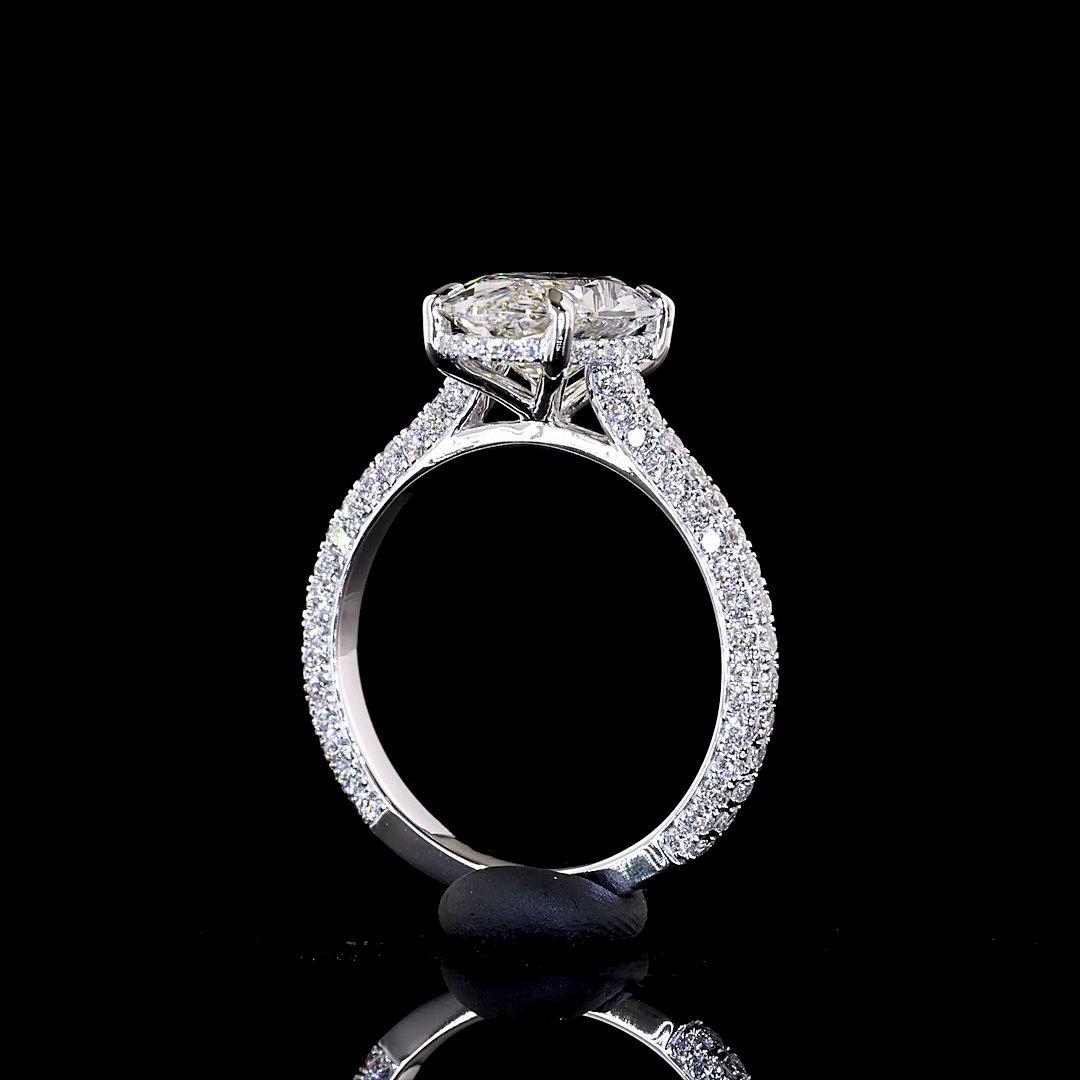 3.55ctw lab grown moval cut diamond engagement ring in 14k white gold with three-sided pavé band.